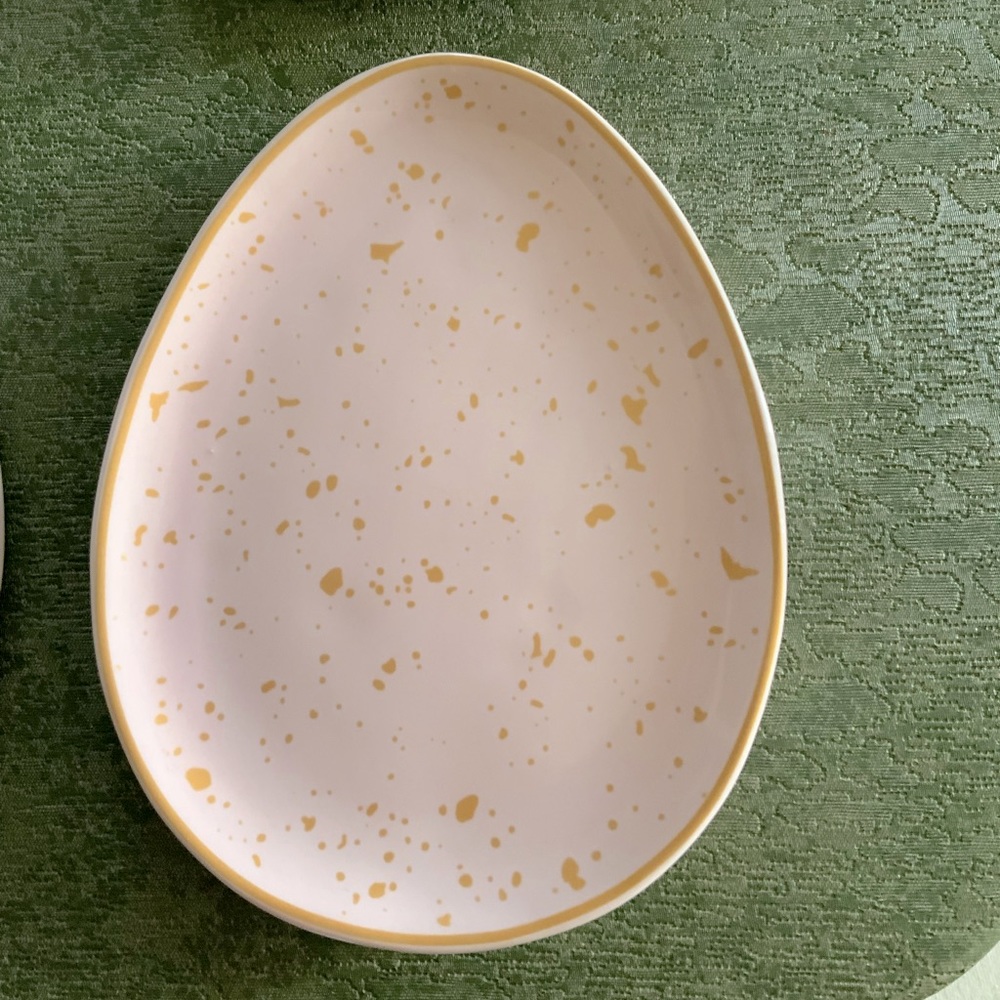 Egg shaped dessert or appetizer plates, stoneware, soft pink with gold fleck.
